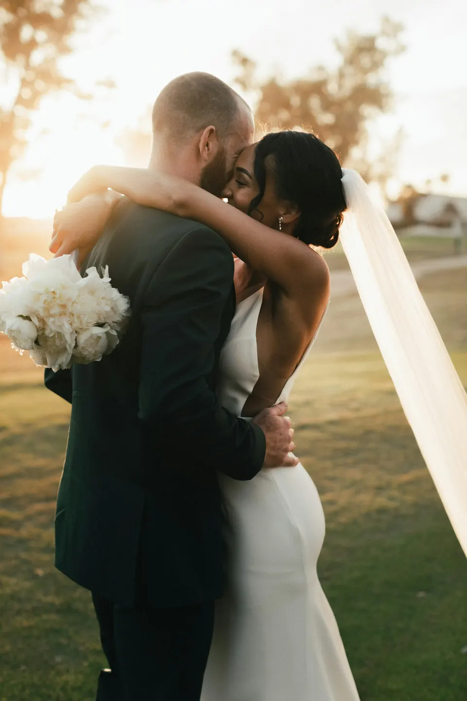 Couple embracing at sunset