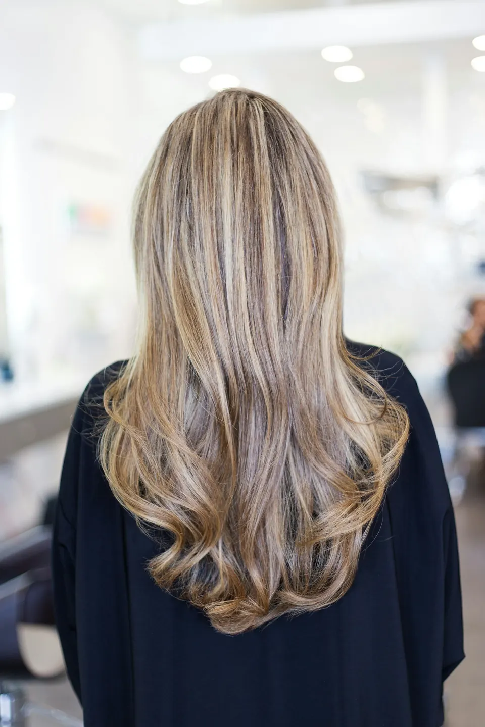 Long blonde balayage with soft waves